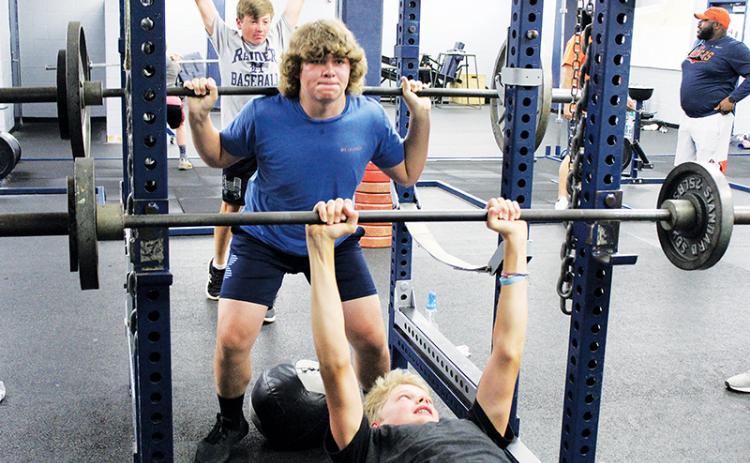 Despite the season being delayed, Wesley Sisk (top) and Jonah Wilson (bottom) are putting in work with sets of squats and bench presses during Habersham Central’s football workouts. Practice begins on July 27, and the Raiders are scheduled to open Sept. 4 against Madison County.