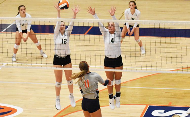 Tallulah Falls’ Barrett Whitener (12) and Abby Carlan (4) protect the net during their match with Habersham Central on Tuesday night.