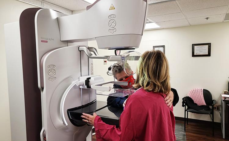 Renee S. Tice, Mammography Technologist at Habersham Medical Center helps a patient receive a mammography examination.