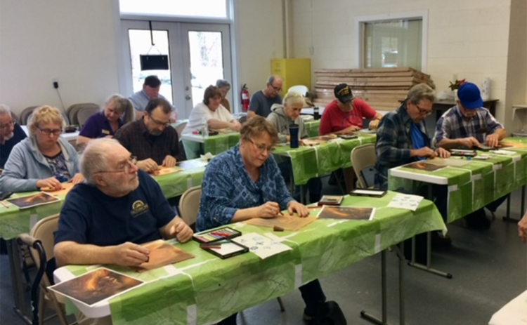 Veterans work on a project in art classes at the Helen Arts Center. RON HILL/Submitted