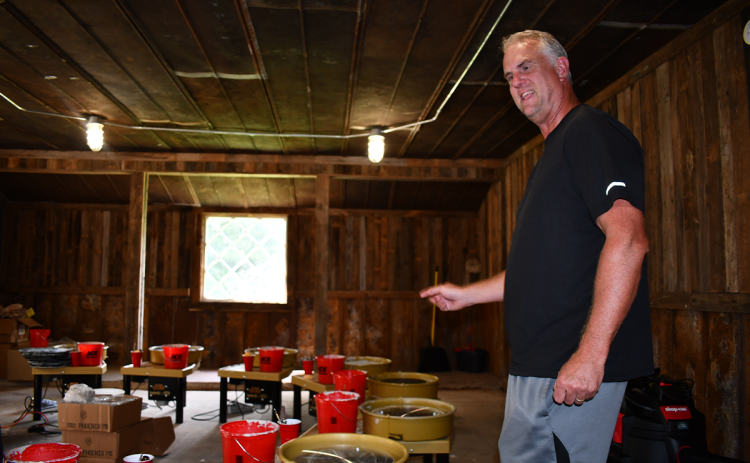Rod Metcalf, licensed mental health coordinator for MECHS, provides a tour of the pottery-making area at Outpost – Mt. Ed’s experiential learning environment for students to engage one another and learn such skills. BRIAN WELLMEIER/Staff