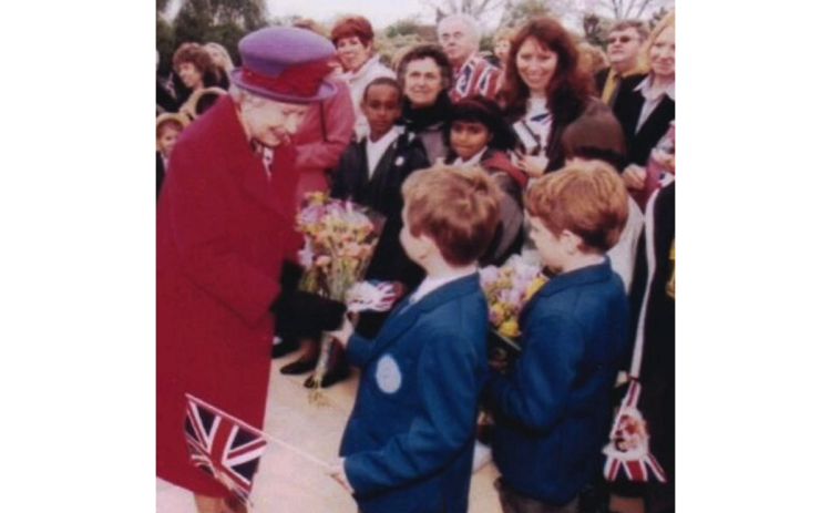 Queen Elizabeth II converses with two children at a jubilee event in 2002. The longtime monarch passed away Sept. 8 at the age of 96 after seven decades as queen. ANYA TAYLOR/Submitted