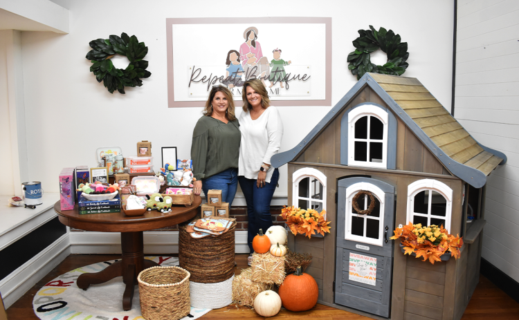 Mother-daughter duo Kaitlin Ellison and Tammie Fleming at their new high-end resale boutique Repeat Boutique, in downtown Cornelia. AMARIS E. RODRIGUEZ/Staff
