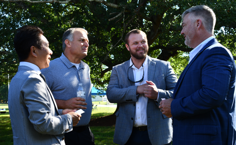 From left, Morito Scovill President and CEO Bunki Yano, CSO Shane McEntyre, Sen. Bo Hatchett and Rep. Victor Anderson greet one another at Scovill’s 220th anniversary celebration Wednesday. BRIAN WELLMEIER/Staff