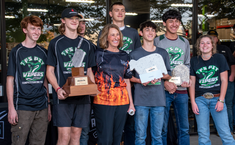 Members of Tallulah Falls School’s Pit Vipers are shown with  Seven-time World BBQ Champion Melissa Cookston (middle). Team members include (from left) Matthew Wolfe, Jake Owensby, Jackson Carlan, Teyrk Tilley, Merrick Carnes, Marc Crotta and Brooke Hayes. SASSY HAYES/Submitted