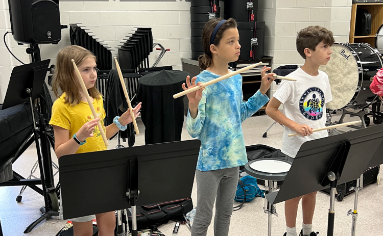 From left, Lorelai Hefner, Ella Barrett and Jacob Hicks work on percussion. NANCY SIMMONS/Submitted
