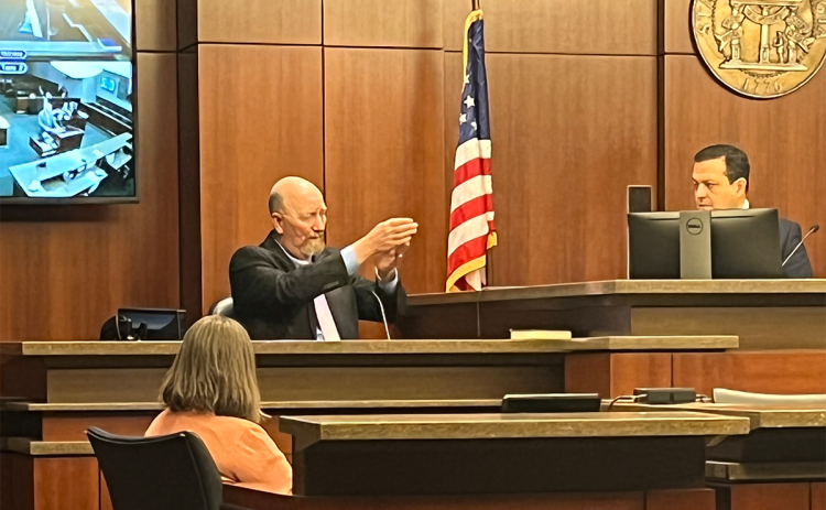Judge Gerald Johnson gestures while testifying Wednesday in a hearing to determine his status as Habersham County’s chief magistrate. MATTHEW OSBORNE/Staff