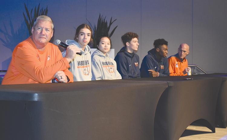 Habersham Central girls basketball coach Bill Bradley responds to a question at the FCA Media Day in Gainesville on Wednesday morning. Joining him on the stage were his players, Kyia Barrett and Jazky Bantaum, along with Raiders Cole Gary and Bryce Pittman, and boys coach Tommy Yancey.
