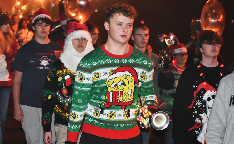 Adam Coloma put himself eternally in contention for top prize at an ugly sweater party. MATTHEW OSBORNE/Staff