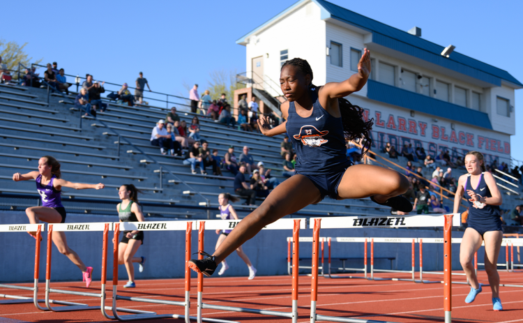 Habersham Central’s Julia Johnson (right) crosses the last row of hurdles in heat two of the Battle of the Blue Ridge track meet. ZACH TAYLOR/Special