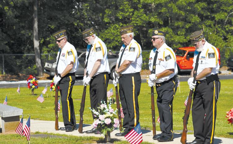 Grant-Reeves Honor Guard members (from left) Rob Wallace, Roy Albea, Barry Church, Ronnie Dotson and Bob Trousdale bow their heads while listening to the Memorial Day remarks Monday morning, MATTHEW OSBORNE/Staff