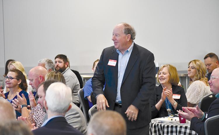 Past United Way President Bob Cook gets a round of applause and appreciation at Thursday’s breakfast at North Technical College.