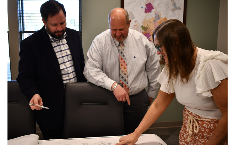 Jessie  Owensby (right), shown talking with Cornelia Mayor John Borrow and City Manager Dee Anderson, was named to the Habersham County Planning commission Monday. FILE