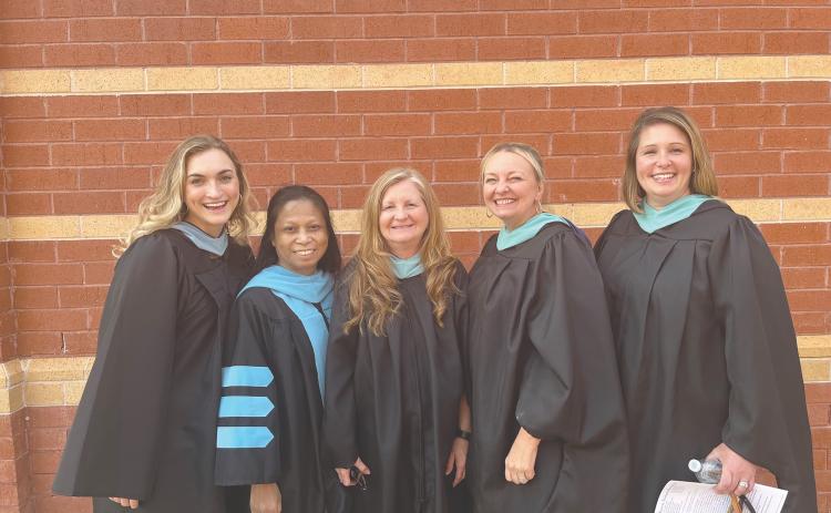 From left, Ryan Lathem, Bounemy Phongsavanh, Vickie Martin, Debra Franklin and Natalie Ziemba, all of the Habersham Success Academy, were all smiles before the Class of 2023 graduated in May. SUBMITTED