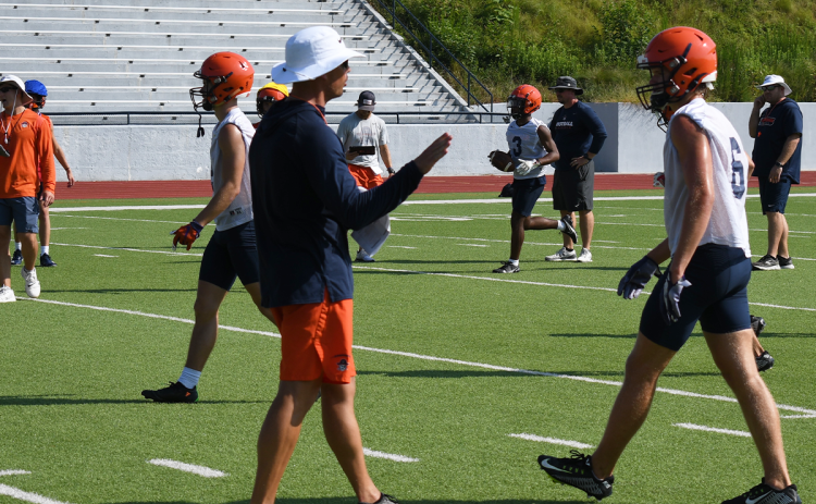 Habersham Central assistant coach Matt Shirley talks with Jonah Wilson at practice on Thursday morning. LANG STOREY/Staff