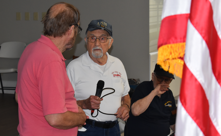 World War II veteran Hank Sawicki (right) talks with Ed Vaughn during his  presentation at the Veterans & Patriots breakfast on Saturday morning. MATTHEW OSBORNE/Staff