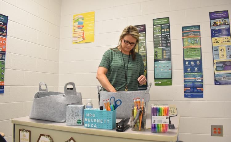 Habersham Central teacher Samantha  Burnett gets her supplies ready for the  upcoming first day for students on Friday. MATTHEW OSBORNE/Staff