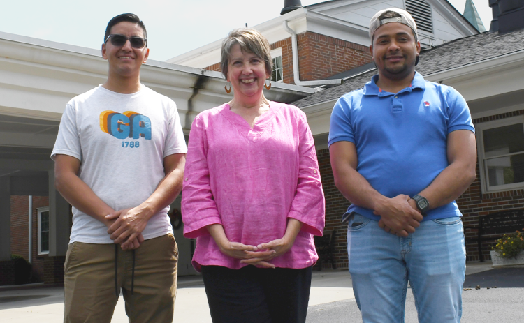 John Chaparro (left) and Gregory Bohada (right) came to Northeast Georgia after leaving their homes in South America. Volunteers for Literacy’s Charlise Rowley (center) continues to teach students like Chaparro and Bohada the English language while helping to further integrate them in America’s society. JOHN DILLS/Staff