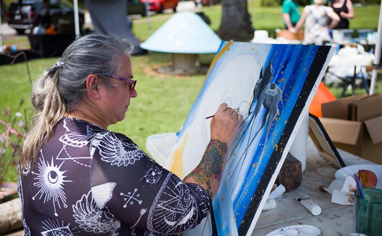 Candace Crow paints her Salvador Dali-inspired portrait of the late artist. ZACH TAYLOR/Special
