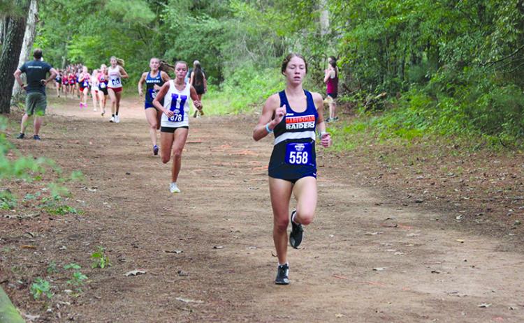 Habersham Central’s Audrey Hotard starts to pull away from the pack in the North Georgia Invitational. MARK TURNER/CNI News Service