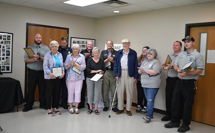 Rabun County First Responders were recognized for their lifesaving efforts when Daniel “Jack” Smith suffered a stroke in June, during a special ceremony at the Rabun County Senior Center last month. Pictured are Logan Carnes; Beverly Mason; Justin Upchurch; Marilyn Ballew; Mike Carnes; Jane Thomason; Gregg Dover; Daniel “Jack” Smith; Katie Coalley; Kenette Turner; Jonathan Watts; and Tate Nichols. MEGAN HORN/The Clayton Tribune