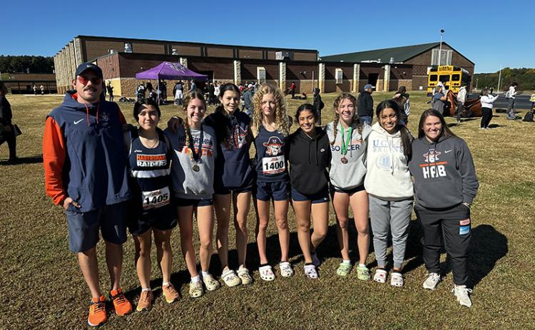 Habersham Central cross country team members shown are (from left) Coach Sebastian  Galloway, Titania Ramirez, Audrey Hotard, Leah Culpepper, Ember Ivester, Yamilez Otero, Abigail Hotard, Kailey Otero and Coach Kaylee Bosley. SUBMITTED