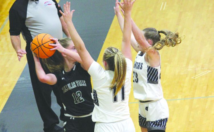 Tallulah Falls’ Millie Holcomb is surrounded by White County defenders on Tuesday night. ELI SHOEMAKE/CNI News Service