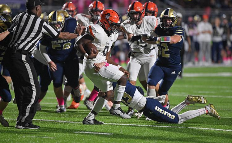 Habersham Central’s Antonio Cantrell does a two-step to escape an Apalachee tackle last Friday night. TOM ASKEW/Special