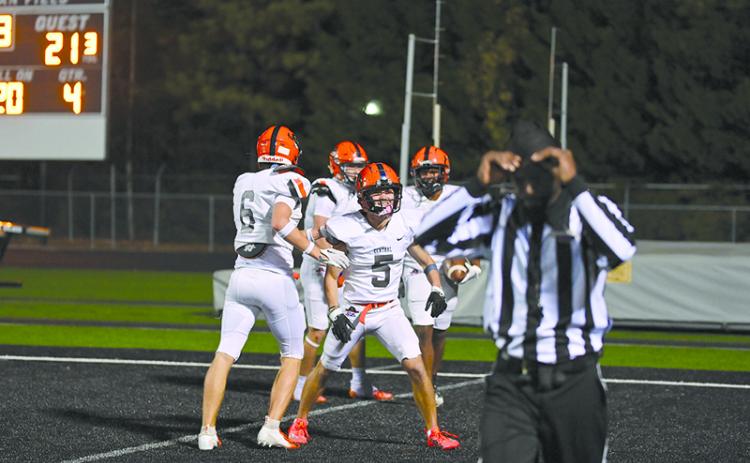 Habersham Central’s Zeke Whittington and Jonah WIlson help celebrate Donnie Warren’s touchdown on Friday night as the Raiders topped Shiloh. TOM ASKEW/Special