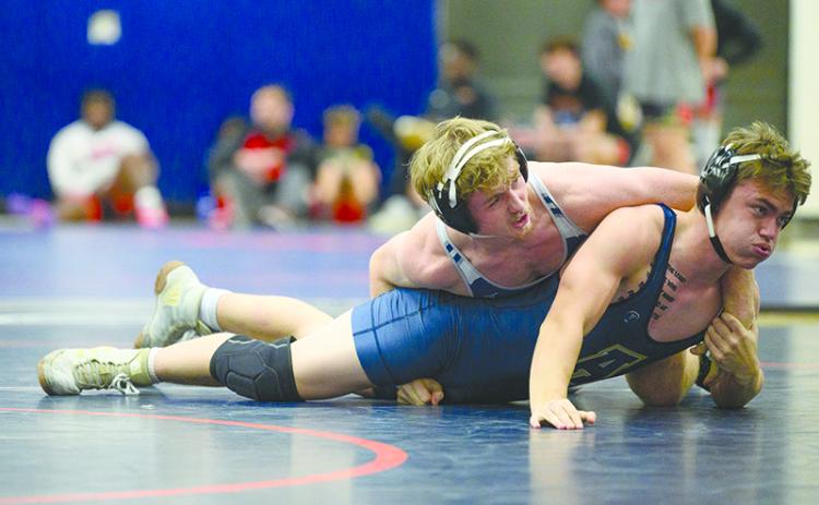 Habersham Central’s Justin Whitney defeats Apalachee’s William Harp by pinfall in the 165-pound weight class during the 2023 Raider invitational. ZACH TAYLOR/Special