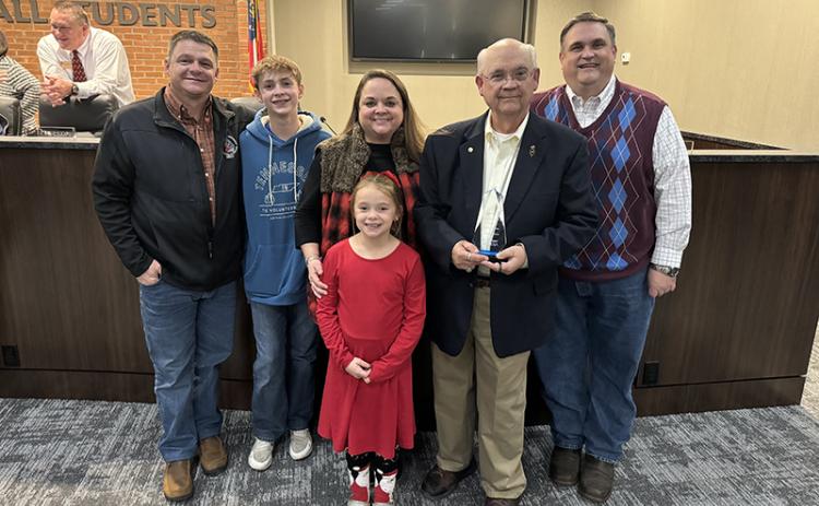 Dr. Robert Barron received his Pioneer in Education award Monday along with family members  (back row, from left) son-in-law Daniel  Ferguson, grandson Cooper Ferguson, daughter Anna Ferguson and son Jeff Barron. In front is granddaughter Emma Ferguson. Other grandchildren not  pictured include  Annalise Gonzalez, James Barron and Conley Barron. MATTHEW OSBORNE/ Staff