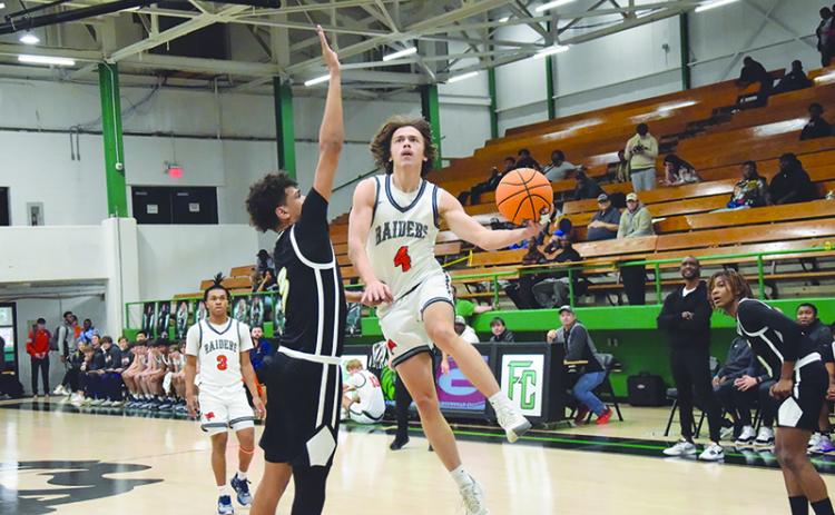 Habersham Central’s Brannon Gaines drives to the hoop last weekend against Greer (S.C.). The Raiders have won seven consecutive games heading into tonight’s game in Cleveland. SHANE SCOGGINS/CNI News Service