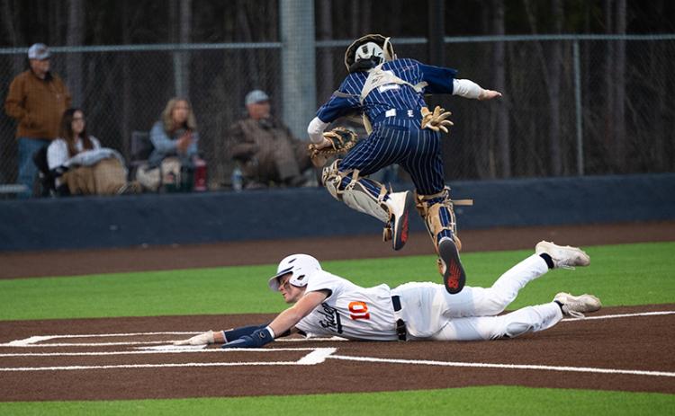 Hayden Gailey slides underneath Elbert County catcher Camden Bryant to put the Raiders ahead of the Blue Devils in the bottom of the 4th of Game 1. ZACH TAYLOR/Special