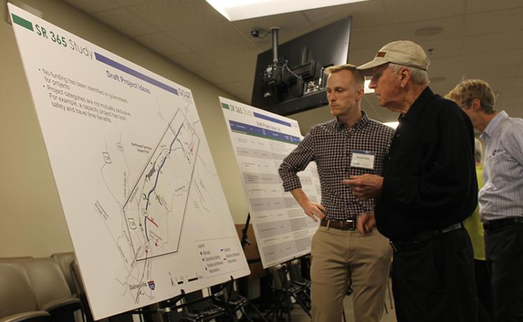 Garnett Smith discusses the traffic study with Hunter Abel of GDOT at Wednesday’s meeting in Gainesville. BRIAN WELLMEIER/Special