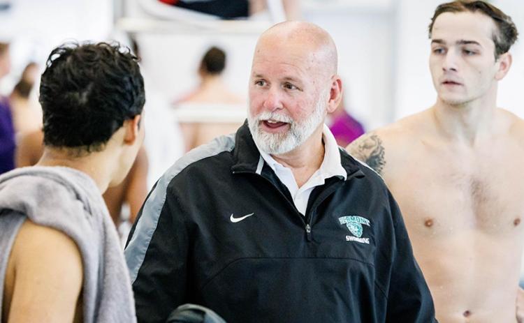 Piedmont swimming coach Teddy Guyer talks with Ross Coppedge (right) and Leandro Forero during a meet this season. SUBMITTED