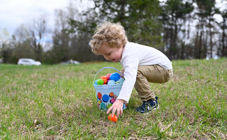 Atticus Khadayat picks up his first-ever Easter eggs in Mt. Airy after becoming ill in March 2023 and unable to participate in last year’s Easter festivities. In October, Khadayat met the flight paramedic who saved his life at the Habersham E-911 event in Clarkesville. ZACH TAYLOR/Special