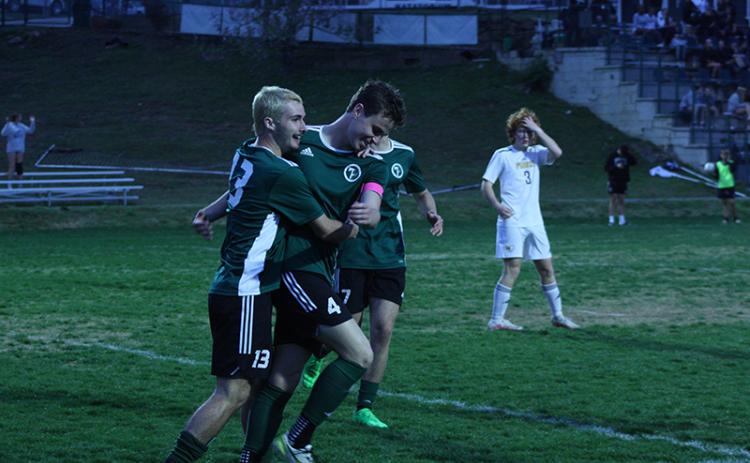 Freshman midfielder Kale Borchers receives a celebratory hug from his teammate Landon Hall after scoring his second goal in a win over Prince Avenue Christian in the first round of the GHSA Class A Division I State Playoffs. Borchers was one of two Indian players to record hat tricks in the match. GREG FINAN JR./Special