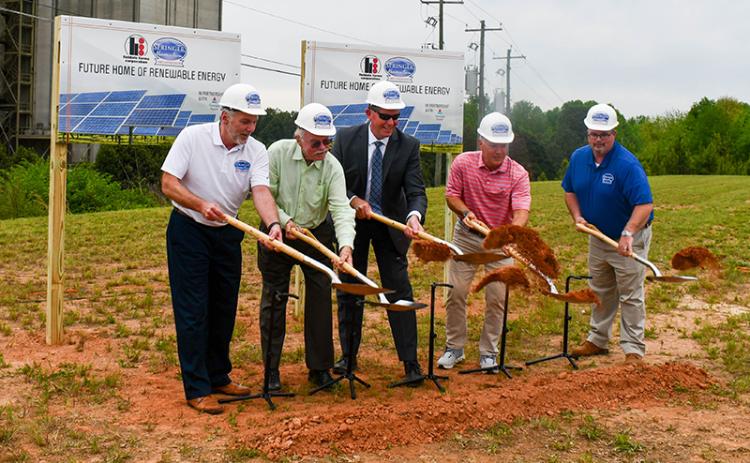 From left, Fieldale Executive Vice President of Sales and Marketing Jeff Paschall, Fieldale President Tom Hensley, Georgia Power Region Director Tony Ferguson, Fieldale Executive Vice President of Operations John Wright and Fieldale Environmental Manager Alex Sullivan break ground at the site of the future solar farm. JULIANNE AKERS/Staff