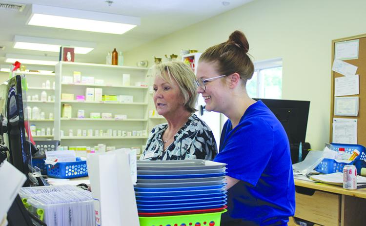 Habersham Drug co-owners Deborah and Hannah Gale work to check prescriptions. BRIAN WELLMEIER/Special