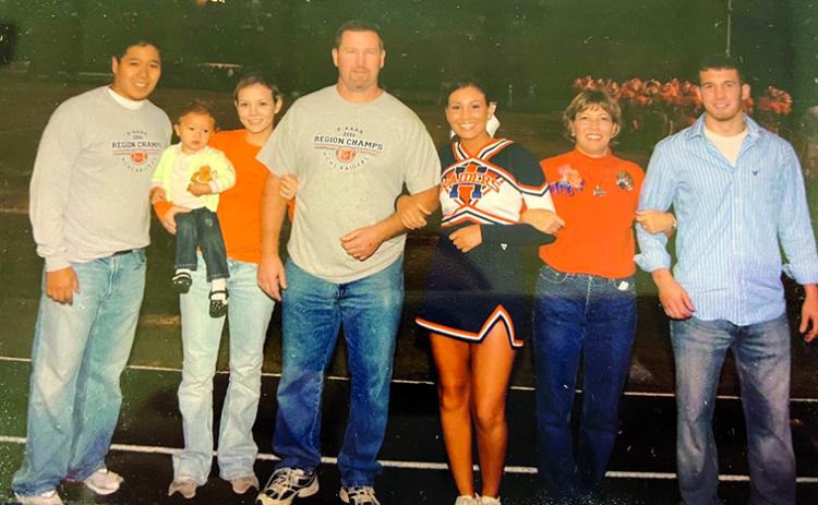 Three decades of Raiders celebrate Brooke Roberts’ senior night as a Habersham Central cheerleader in the fall of 2007. From left: Ray Contreras, Kali Contreras (as a baby), Brittany Contreras, Mike Roberts, Brooke Roberts, Terri Roberts and Matt Roberts. SUBMITTED