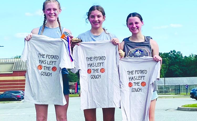 Top 3 finishers (from left) Tessa Murdock, Sadie Chambers and Mackenzie Gosnell show off their 5K T-shirts. SUBMITTED