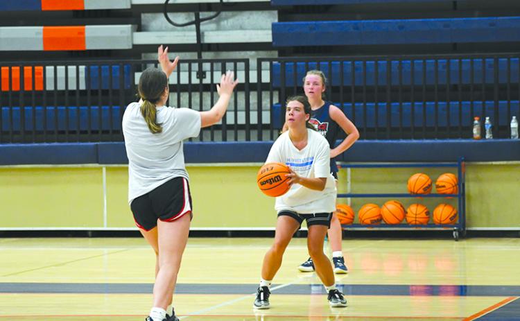 Katie Roberts pulls up for a corner 3 during open gym earlier this week. LANG STOREY/Staff